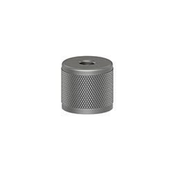 A circular MH149-1A stainless steel accelerometer mounting magnet with a flat bottom, knurled ring around the perimeter, and circular through-hole in the center of the top.