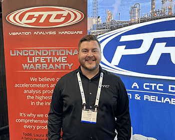 A CTC Sales Team member wearing a black CTC polo shirt at a trade show, standing in front of a blue PRO Line banner and a red CTC Line banner