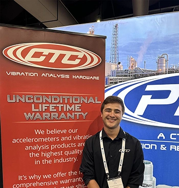 A CTC Sales Team member wearing a black CTC polo shirt at a trade show, standing in front of a blue PRO Line banner and a red CTC Line banner