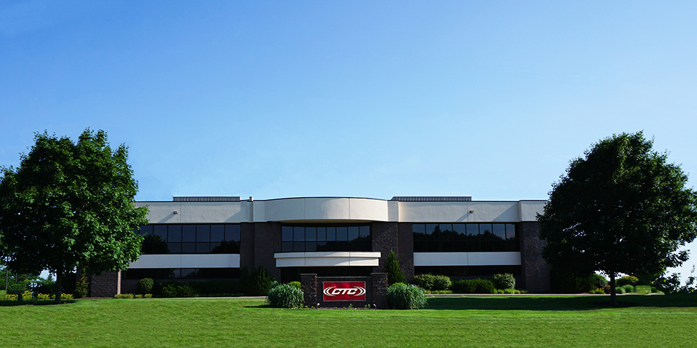 exterior view of the state-of-the-art, two-floor CTC facility building in Victor, New York on a sunny summer day